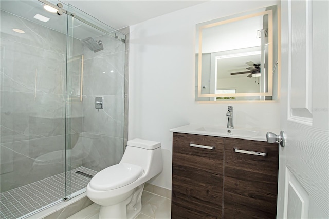 4324 Garden Ave, West Palm Beach, FL 33405 - full bathroom featuring a shower stall, toilet, vanity, ceiling fan, and tile patterned flooring
