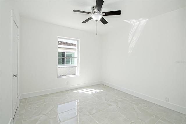 4324 Garden Ave, West Palm Beach, FL 33405 - unfurnished room with baseboards, light marble finish flooring, and ceiling fan