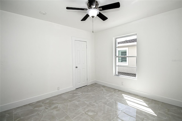 4324 Garden Ave, West Palm Beach, FL 33405 - spare room featuring baseboards, light marble finish flooring, and ceiling fan