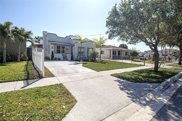 4324 Garden Ave, West Palm Beach, FL 33405 - mediterranean / spanish home featuring driveway and stucco siding