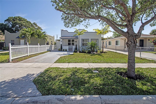 4324 Garden Ave, West Palm Beach, FL 33405 - mediterranean / spanish-style house featuring stucco siding and concrete driveway