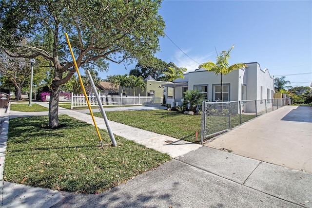 4324 Garden Ave, West Palm Beach, FL 33405 - view of front of home with stucco siding and driveway