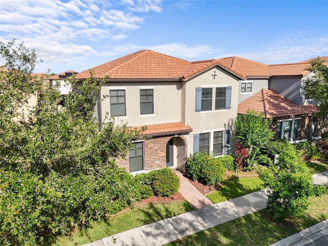 1978 Fishtail Fern Way, Ocoee, FL 34761 - mediterranean / spanish-style house featuring a tiled roof and stucco siding