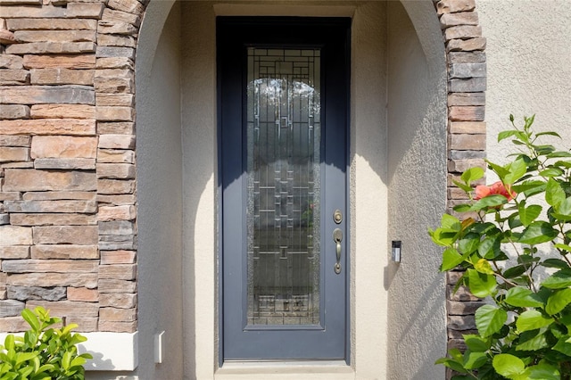 1978 Fishtail Fern Way, Ocoee, FL 34761 - doorway to property with stone siding