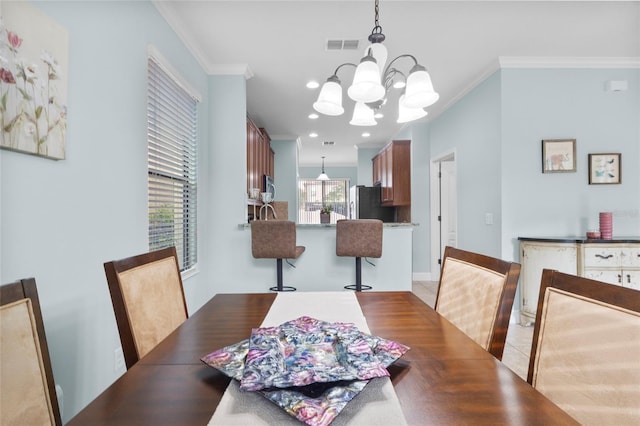 1978 Fishtail Fern Way, Ocoee, FL 34761 - dining room featuring crown molding and a chandelier