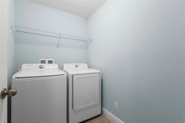 1978 Fishtail Fern Way, Ocoee, FL 34761 - laundry room featuring separate washer and dryer and baseboards