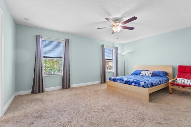 1978 Fishtail Fern Way, Ocoee, FL 34761 - bedroom with carpet floors, baseboards, a textured ceiling, and ceiling fan