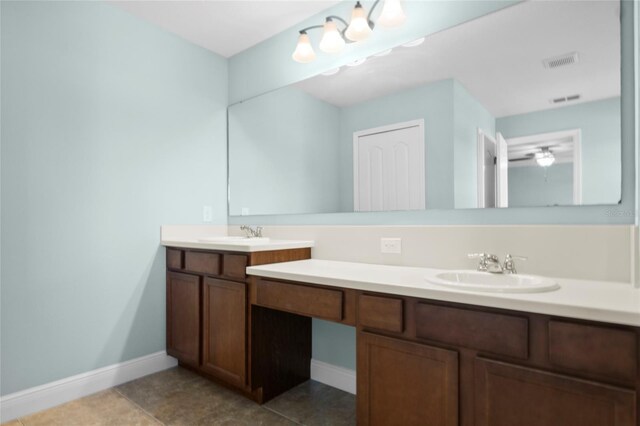 1978 Fishtail Fern Way, Ocoee, FL 34761 - bathroom with baseboards, double vanity, and tile patterned flooring