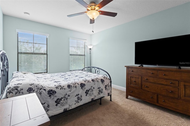 1978 Fishtail Fern Way, Ocoee, FL 34761 - bedroom with light colored carpet, baseboards, and ceiling fan