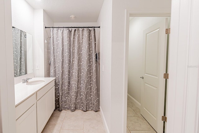 full bath with tile patterned flooring, vanity, and a shower with curtain