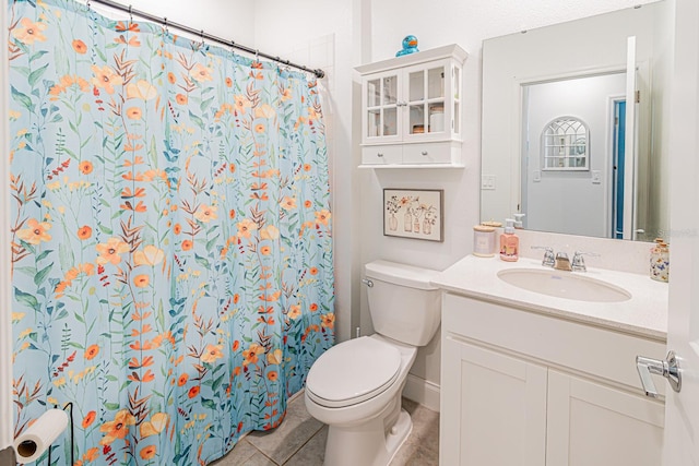 full bathroom with tile patterned flooring, toilet, vanity, and curtained shower
