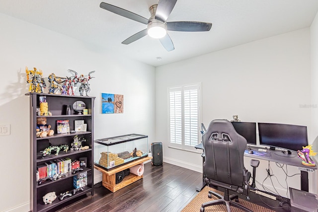office space featuring dark wood-type flooring, baseboards, and ceiling fan