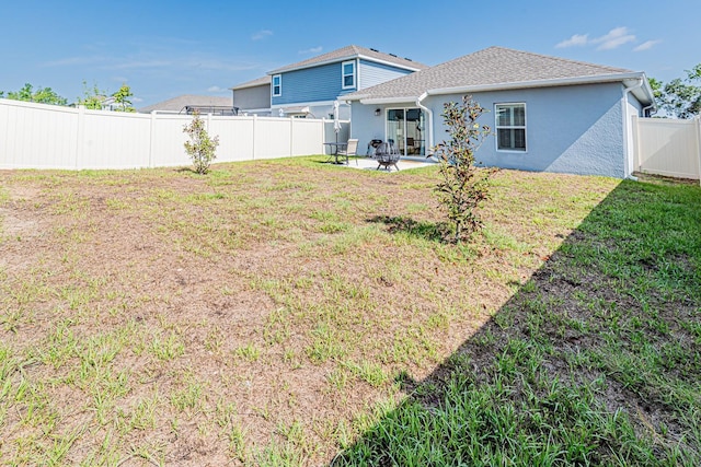 back of house featuring stucco siding and a patio