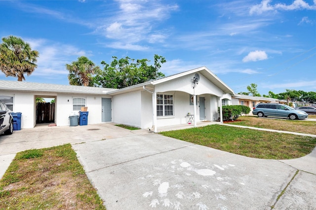 6528/6530 12th St W, Bradenton, FL 34207 - single story home featuring driveway, stucco siding, and a front lawn