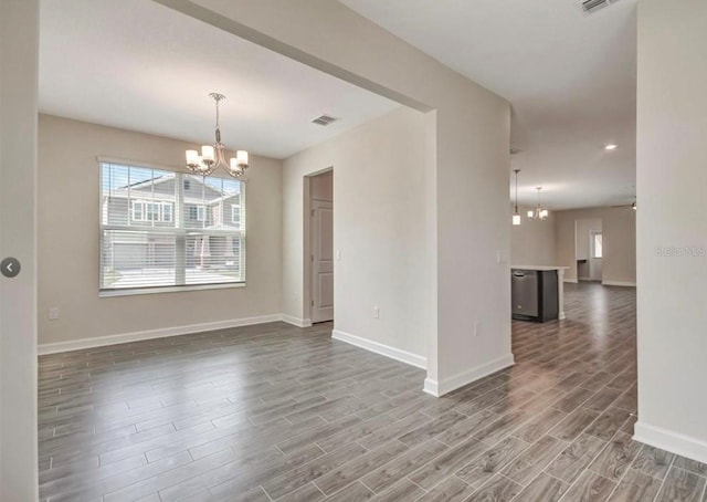 11807 Charades St, Orlando, FL 32832 - empty room with a chandelier, healthy amount of natural light, wood finished floors, baseboards, and recessed lighting