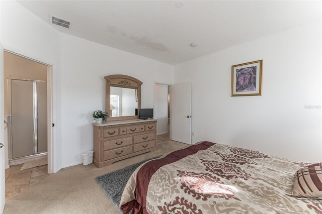 bedroom featuring light carpet