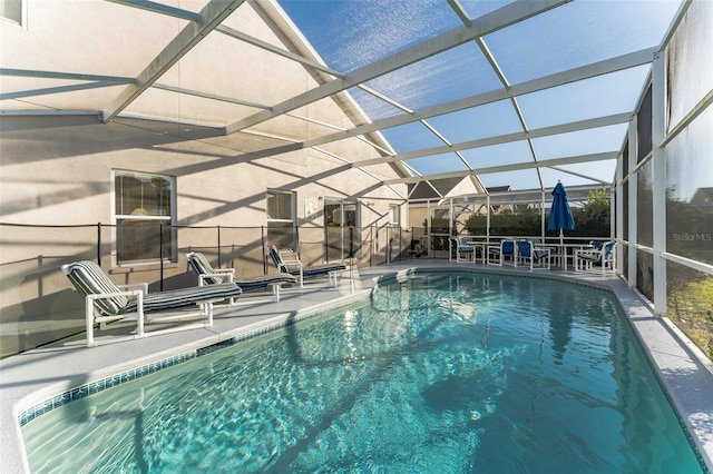 swimming pool featuring a patio area and a lanai