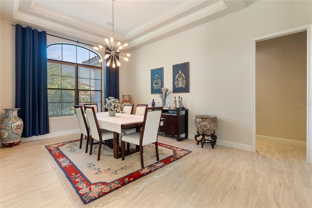11706 Waterstone Loop Dr, Windermere, FL 34786 - dining space with a raised ceiling, a chandelier, ornamental molding, and baseboards