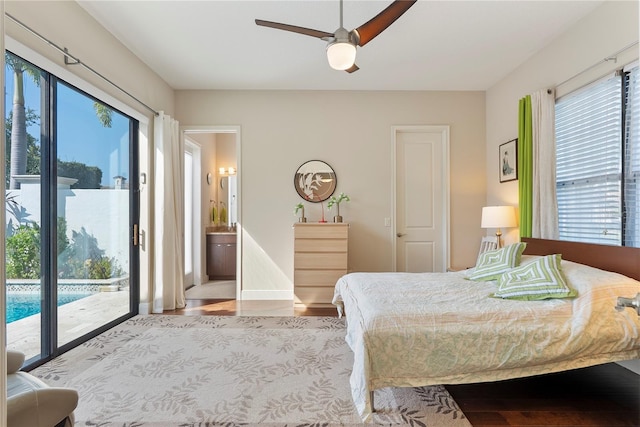 11706 Waterstone Loop Dr, Windermere, FL 34786 - bedroom featuring access to exterior, multiple windows, and wood finished floors