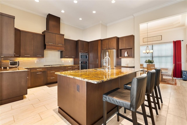 11706 Waterstone Loop Dr, Windermere, FL 34786 - kitchen with stainless steel appliances, a sink, a breakfast bar area, recessed lighting, and backsplash