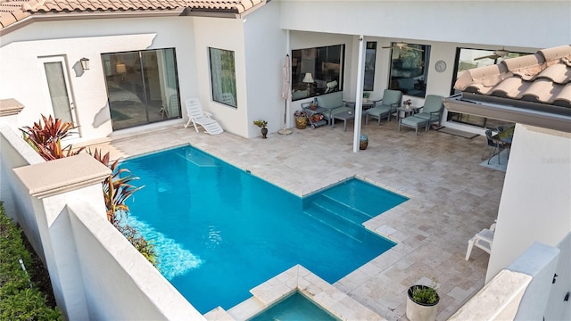 11706 Waterstone Loop Dr, Windermere, FL 34786 - swimming pool featuring a patio and an outdoor hangout area