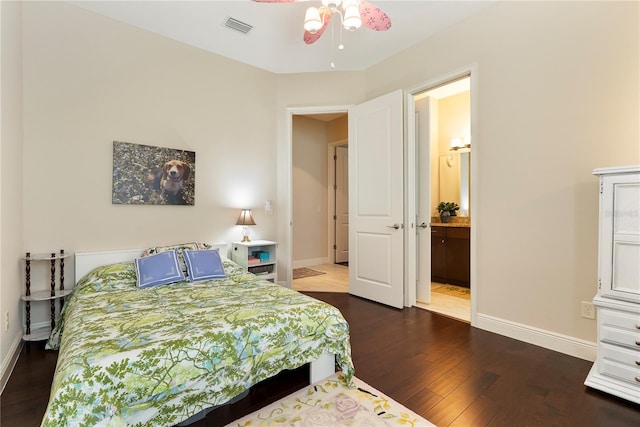 11706 Waterstone Loop Dr, Windermere, FL 34786 - bedroom with dark wood finished floors, baseboards, and ensuite bathroom