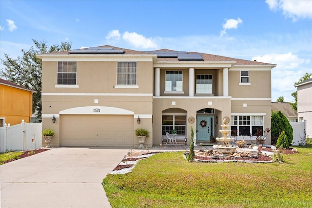 16 Sawfish Ct, Kissimmee, FL 34759 - view of front of house featuring stucco siding, driveway, a garage, and solar panels
