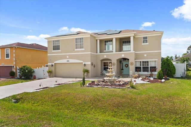 16 Sawfish Ct, Kissimmee, FL 34759 - view of front of house with a garage, driveway, stucco siding, and solar panels