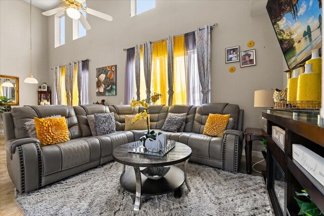 16 Sawfish Ct, Kissimmee, FL 34759 - living room featuring ceiling fan and a towering ceiling