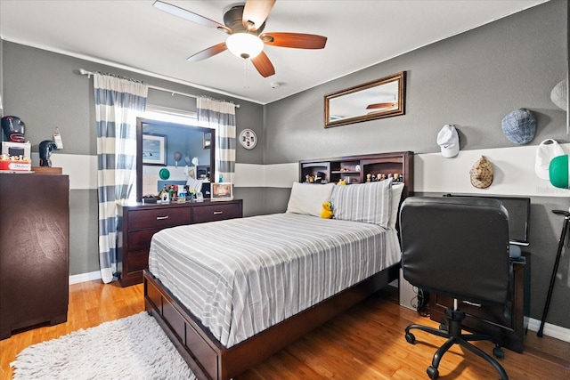 16 Sawfish Ct, Kissimmee, FL 34759 - bedroom with light wood-type flooring, baseboards, and a ceiling fan