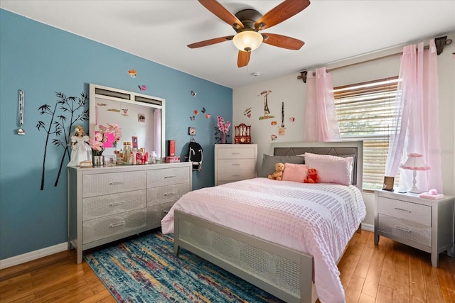 16 Sawfish Ct, Kissimmee, FL 34759 - bedroom with light wood-style flooring, baseboards, and ceiling fan