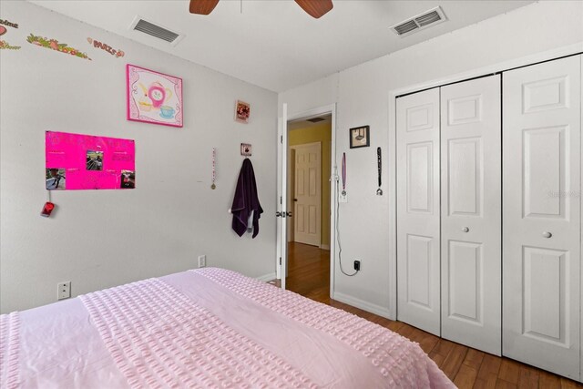 16 Sawfish Ct, Kissimmee, FL 34759 - bedroom featuring wood finished floors, a closet, a ceiling fan, and baseboards