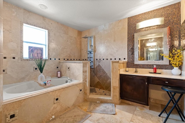 16 Sawfish Ct, Kissimmee, FL 34759 - bathroom with tile walls, a stall shower, a garden tub, vanity, and tile patterned floors