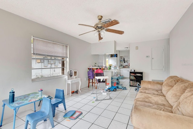 6524/6526 12th St W, Bradenton, FL 34207 - living room featuring ceiling fan, light tile patterned flooring, and a textured ceiling