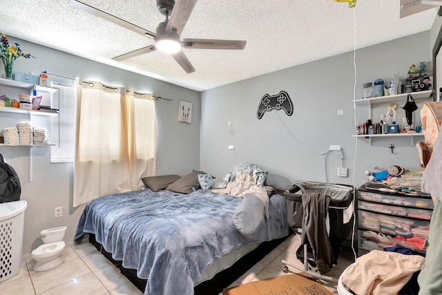 6524/6526 12th St W, Bradenton, FL 34207 - bedroom with light tile patterned floors, a textured ceiling, and a ceiling fan