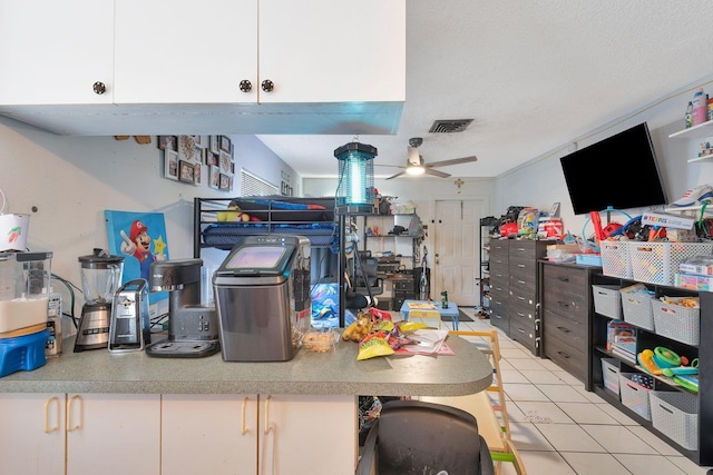 6524/6526 12th St W, Bradenton, FL 34207 - interior space with a ceiling fan, light tile patterned floors, and a textured ceiling