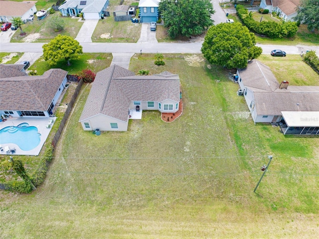 aerial view of residential area with a pool