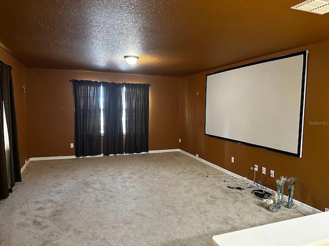 12610 Sawgrass Oak St, Orlando, FL 32824 - carpeted cinema room with baseboards and a textured ceiling