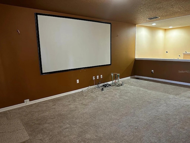 12610 Sawgrass Oak St, Orlando, FL 32824 - carpeted home theater room with a textured ceiling, baseboards, and recessed lighting