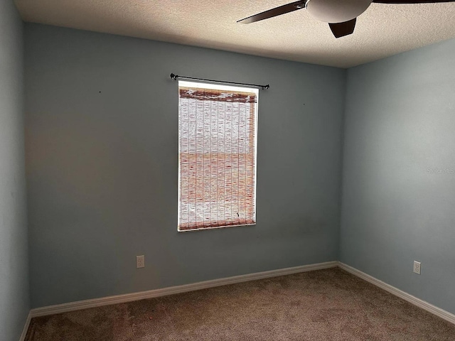 12610 Sawgrass Oak St, Orlando, FL 32824 - carpeted empty room featuring a ceiling fan, baseboards, and a textured ceiling