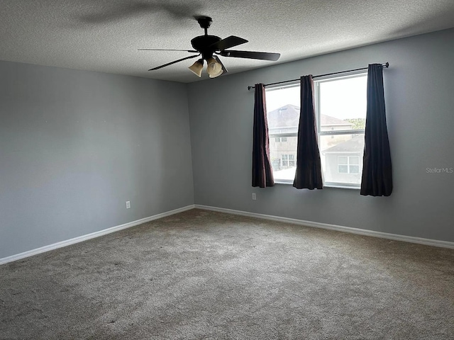 12610 Sawgrass Oak St, Orlando, FL 32824 - empty room with carpet, a textured ceiling, ceiling fan, and baseboards
