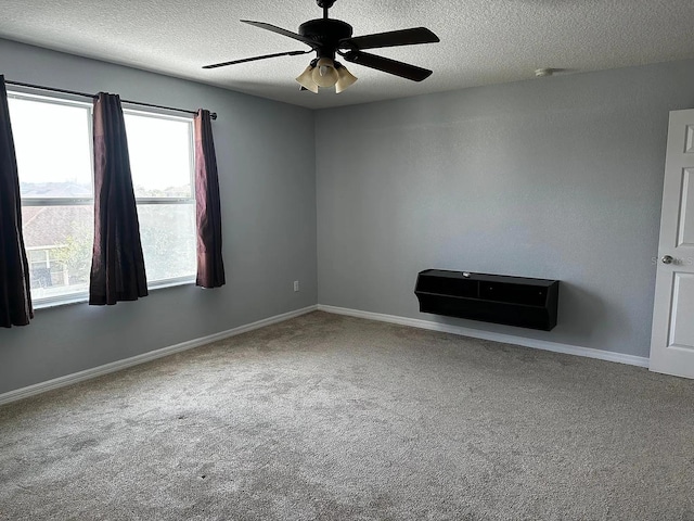 12610 Sawgrass Oak St, Orlando, FL 32824 - carpeted empty room featuring a textured ceiling, ceiling fan, and baseboards
