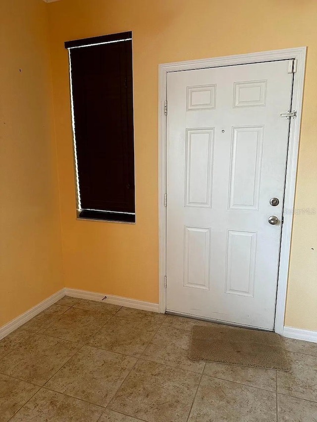 12610 Sawgrass Oak St, Orlando, FL 32824 - tiled spare room with baseboards