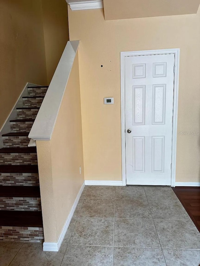 12610 Sawgrass Oak St, Orlando, FL 32824 - tiled foyer entrance featuring baseboards and stairway