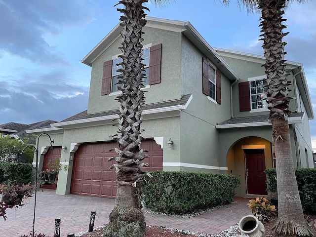12610 Sawgrass Oak St, Orlando, FL 32824 - view of front of property with stucco siding and an attached garage