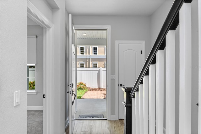117 E Concord St Unit 7, Orlando, FL 32801 - foyer featuring stairs, wood finished floors, and baseboards