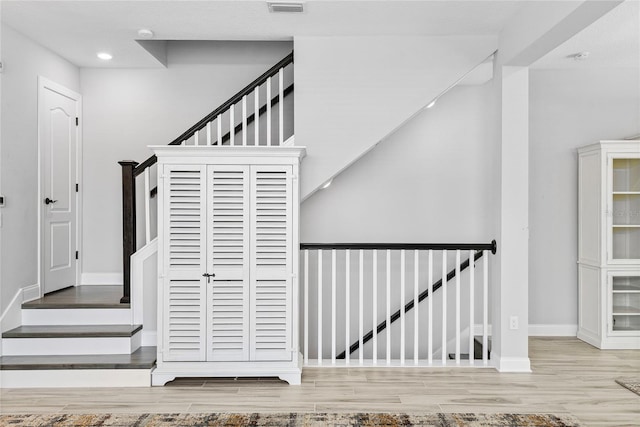 117 E Concord St Unit 7, Orlando, FL 32801 - stairs with wood finished floors, baseboards, and recessed lighting