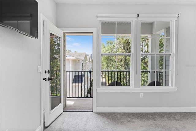 117 E Concord St Unit 7, Orlando, FL 32801 - doorway with carpet flooring, baseboards, and plenty of natural light