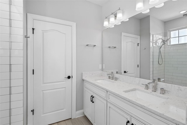 117 E Concord St Unit 7, Orlando, FL 32801 - bathroom with a tile shower and double vanity
