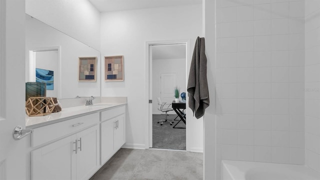 full bath with vanity and baseboards